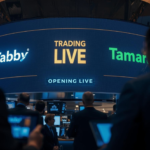 A digital stock ticker board at the Saudi Exchange (Tadawul) displaying the green trading symbols for 'TABBY' and 'TAMARA' in 2026.